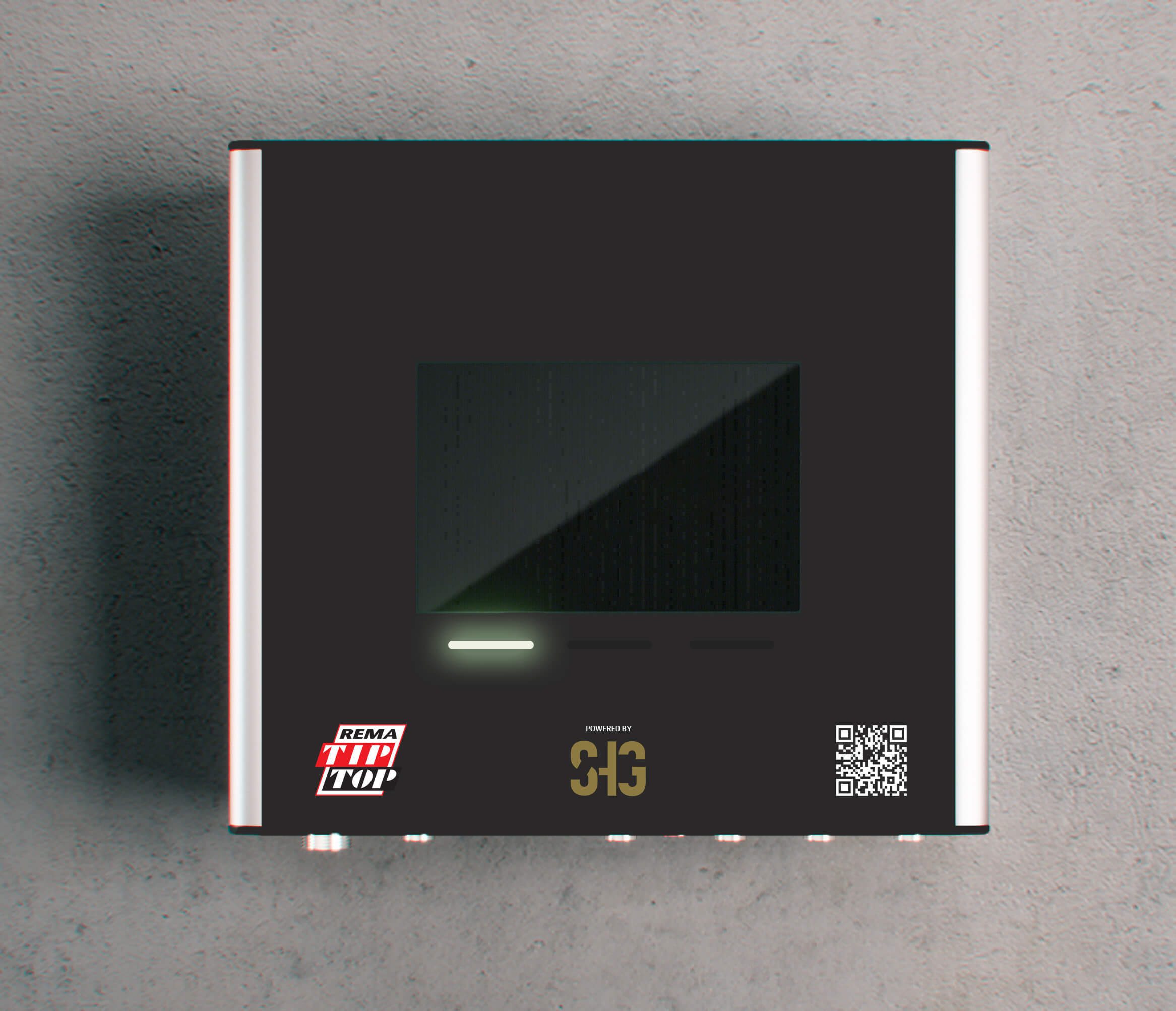 Black electronic device with a display screen, branding logos on the left and bottom, and a QR code on the right, mounted on a gray wall.