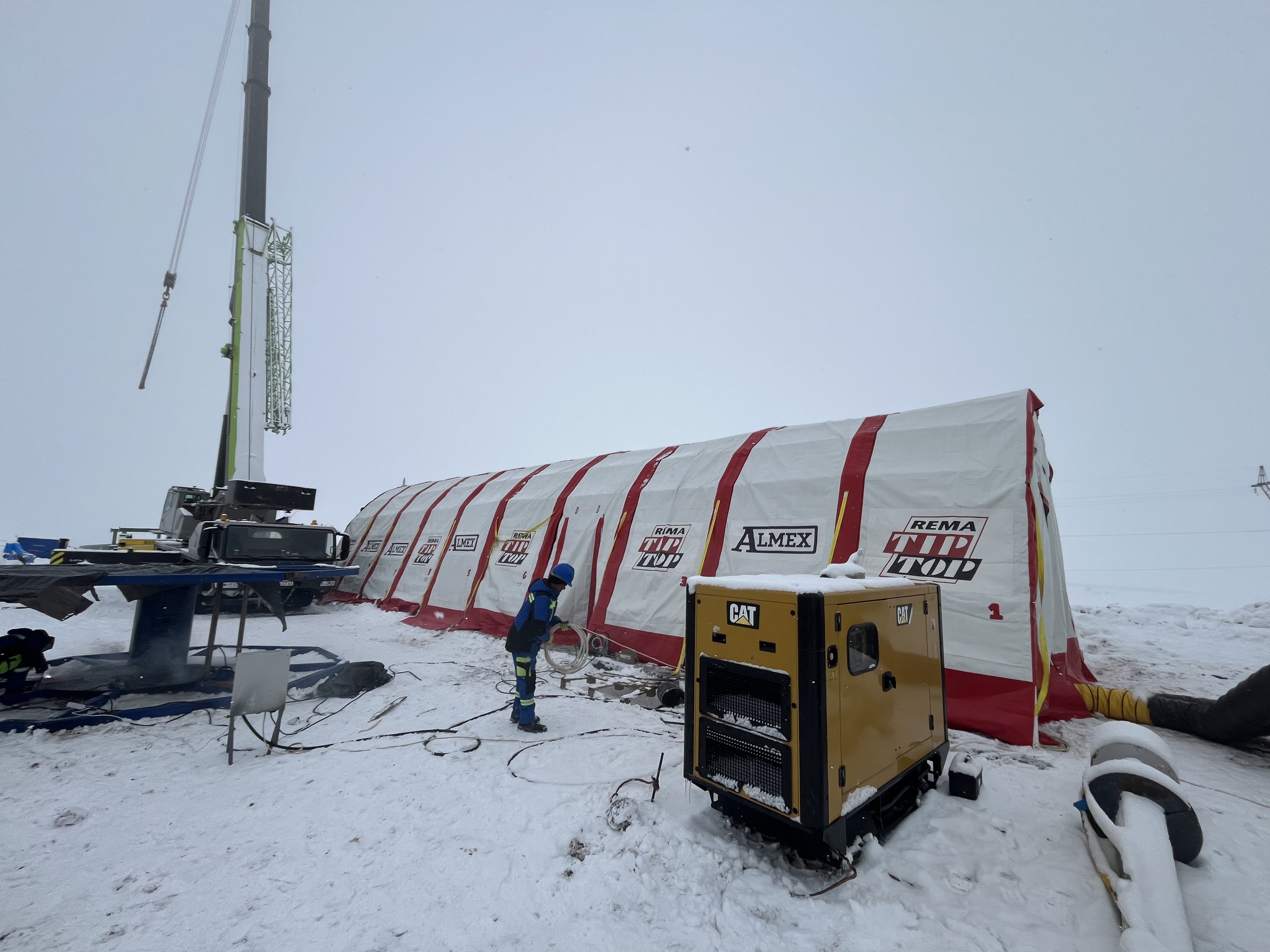 ALMEX and REMA TIP TOP vulcanizing tent setup with crane at Armenian gold mine