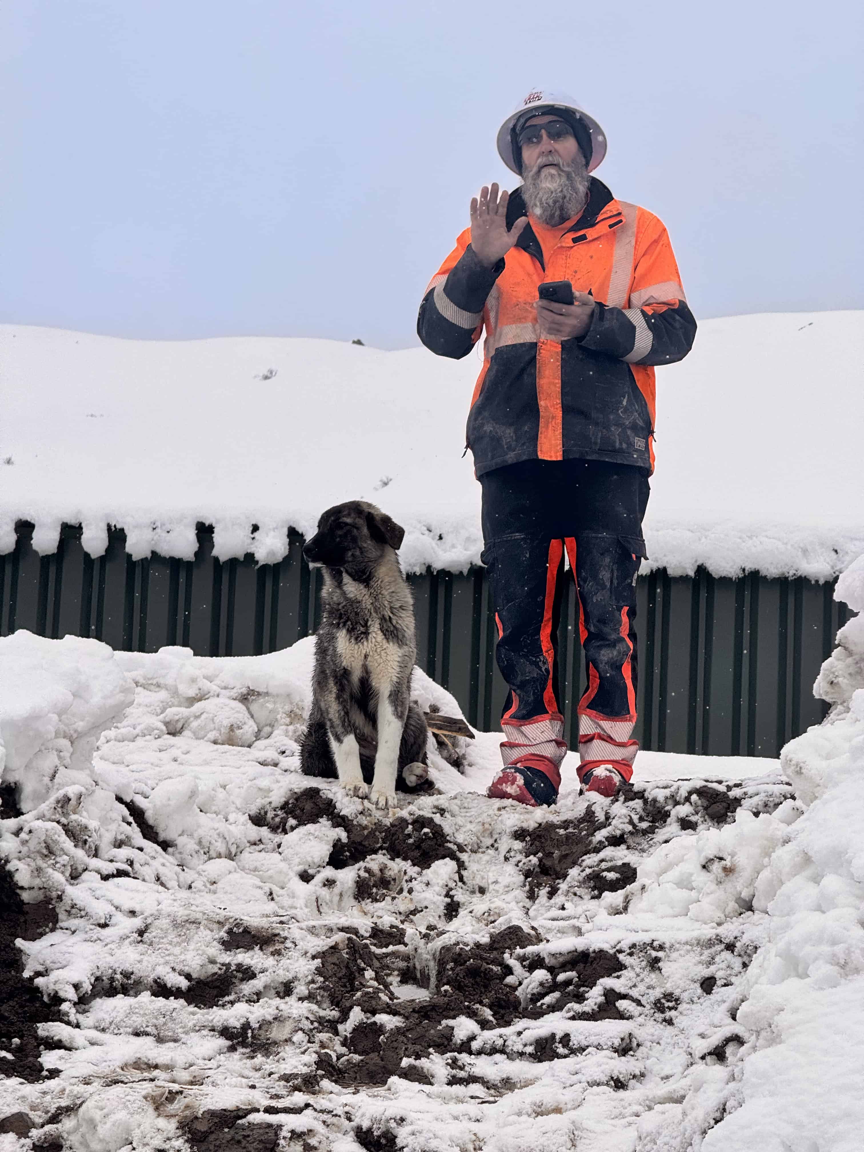 REMA TIP TOP Australia Special Projects Manager Ben with mountain dog on snowy Armenian mine site